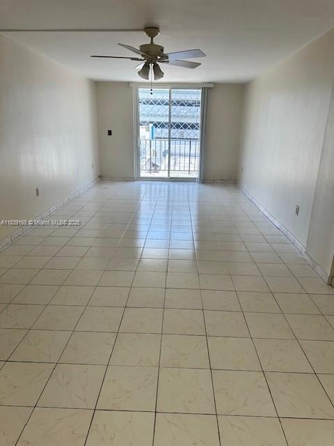 720 Collins Ave Unit 310, Miami Beach, FL 33139 - unfurnished room with ceiling fan and light tile patterned floors