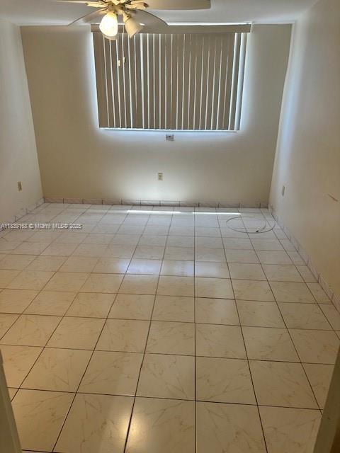 720 Collins Ave Unit 310, Miami Beach, FL 33139 - spare room featuring a ceiling fan and tile patterned flooring