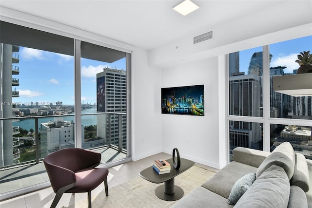 227 NE 2nd St Unit 2000, Miami, FL 33132 - tiled living room featuring floor to ceiling windows and baseboards