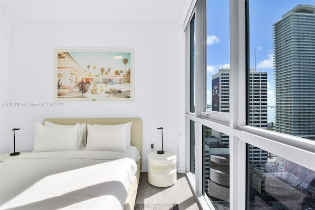 227 NE 2nd St Unit 2000, Miami, FL 33132 - bedroom with tile patterned flooring and a city view