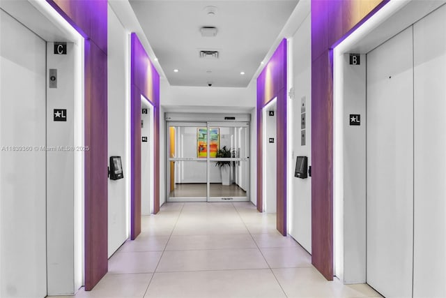 227 NE 2nd St Unit 2000, Miami, FL 33132 - hallway featuring elevator, recessed lighting, and light tile patterned floors