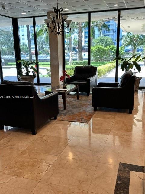 400 S Kings Point Dr Unit 806, Sunny Isles Beach, FL 33160 - community lobby featuring a wall of windows