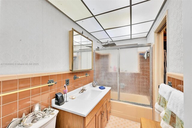 85 NW 21st St, Homestead, FL 33030 - bathroom with combined bath / shower with glass door, vanity, and tile walls