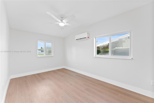 7021 SW 12th St, Pembroke Pines, FL 33023 - empty room with an AC wall unit, wood finished floors, healthy amount of natural light, a ceiling fan, and vaulted ceiling