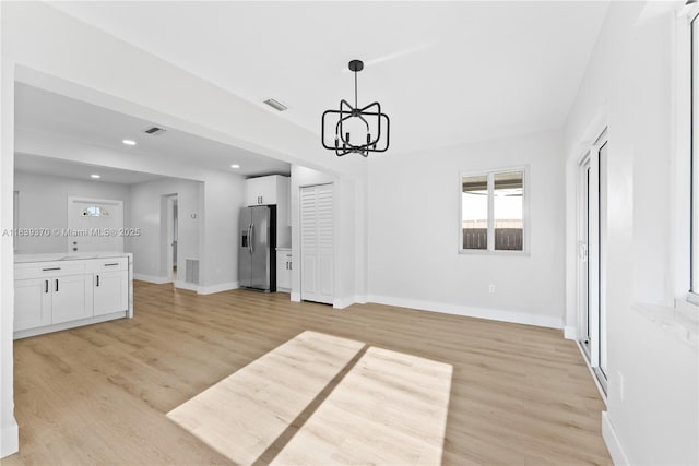 7021 SW 12th St, Pembroke Pines, FL 33023 - unfurnished dining area featuring a chandelier, plenty of natural light, light wood finished floors, and recessed lighting