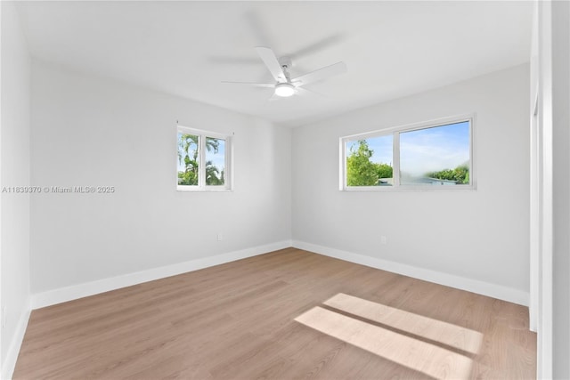 7021 SW 12th St, Pembroke Pines, FL 33023 - empty room with healthy amount of natural light, a ceiling fan, and wood finished floors