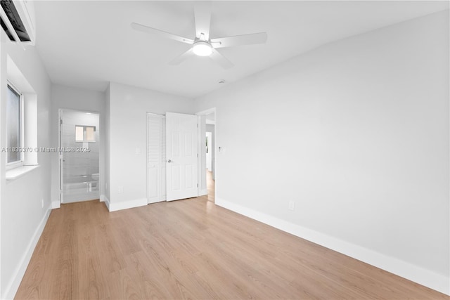 7021 SW 12th St, Pembroke Pines, FL 33023 - unfurnished bedroom featuring light wood-type flooring, connected bathroom, a ceiling fan, and a closet
