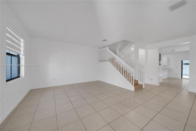 12960 SW 232nd Ln, Homestead, FL 33032 - unfurnished living room with stairs and light tile patterned floors