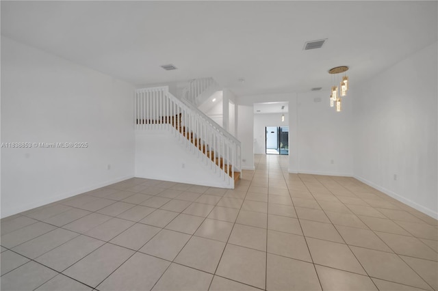 12960 SW 232nd Ln, Homestead, FL 33032 - unfurnished room featuring stairs, light tile patterned floors, and a chandelier