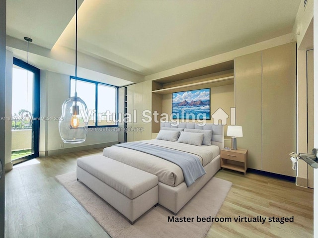 201 Crandon Blvd Unit 305, Key Biscayne, FL 33149 - bedroom with light wood-style flooring