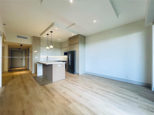 201 Crandon Blvd Unit 305, Key Biscayne, FL 33149 - kitchen featuring black refrigerator with ice dispenser, light countertops, light wood finished floors, modern cabinets, and recessed lighting