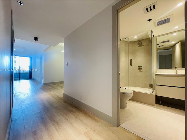 201 Crandon Blvd Unit 305, Key Biscayne, FL 33149 - hallway featuring light wood-style flooring and baseboards