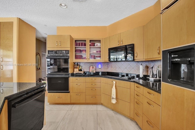 9940 SW 4th St, Plantation, FL 33324 - kitchen featuring black appliances, a textured ceiling, decorative backsplash, dark stone countertops, and glass insert cabinets