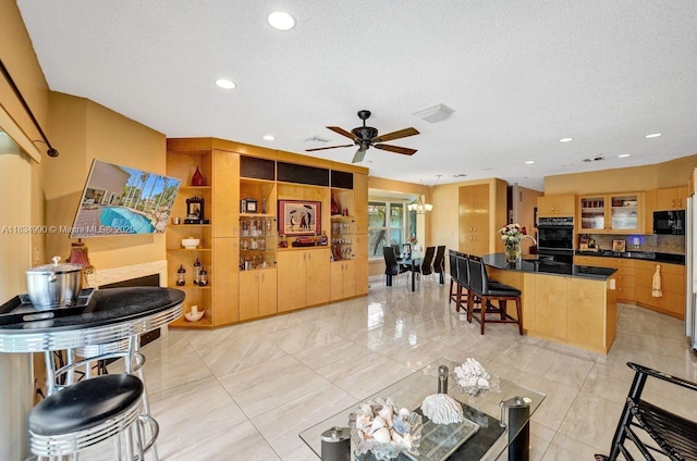 9940 SW 4th St, Plantation, FL 33324 - living area with ceiling fan, recessed lighting, and a textured ceiling
