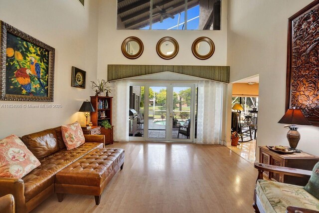 9940 SW 4th St, Plantation, FL 33324 - living area with a high ceiling, plenty of natural light, and wood finished floors