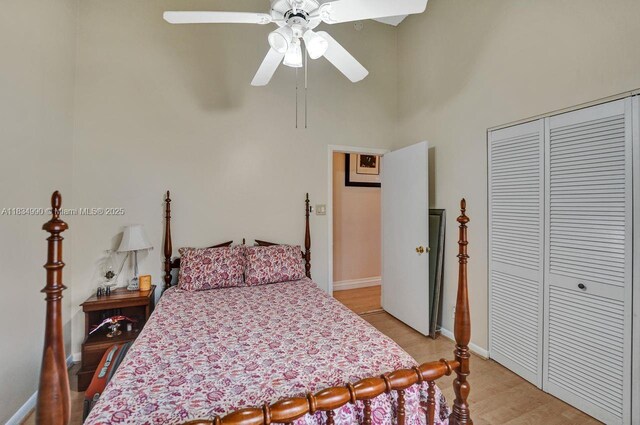 9940 SW 4th St, Plantation, FL 33324 - bedroom with a closet, light wood-type flooring, ceiling fan, and a towering ceiling