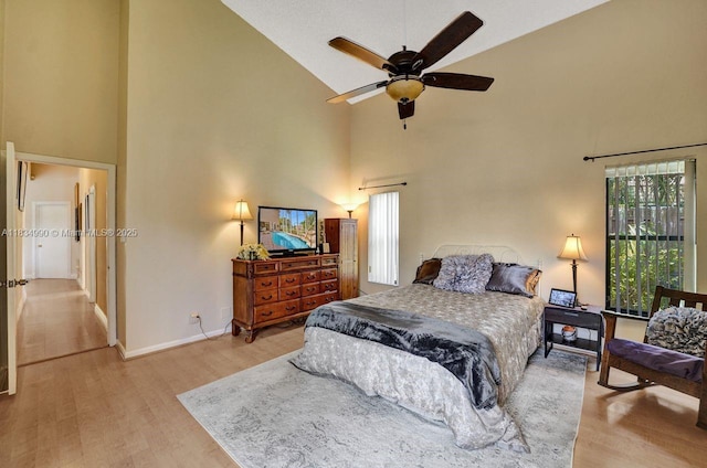 9940 SW 4th St, Plantation, FL 33324 - bedroom with high vaulted ceiling, wood finished floors, and ceiling fan