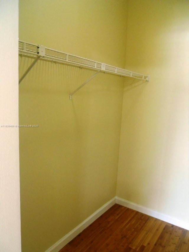 2091 NW 96th Ter Unit 13A, Pembroke Pines, FL 33024 - spacious closet with dark wood-style floors