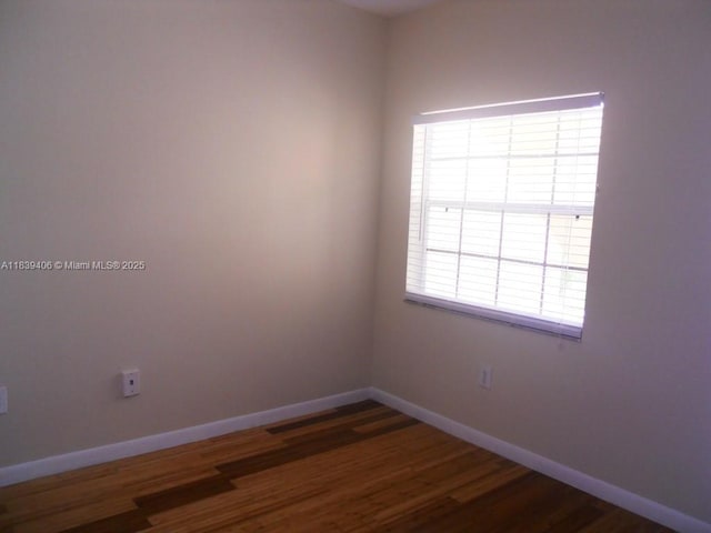 2091 NW 96th Ter Unit 13A, Pembroke Pines, FL 33024 - spare room with baseboards and wood finished floors