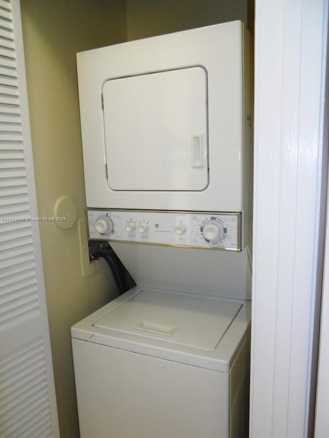2091 NW 96th Ter Unit 13A, Pembroke Pines, FL 33024 - washroom with stacked washer and clothes dryer