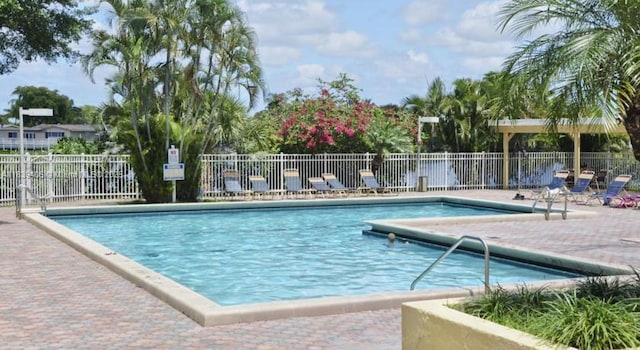 2091 NW 96th Ter Unit 13A, Pembroke Pines, FL 33024 - community pool with a patio