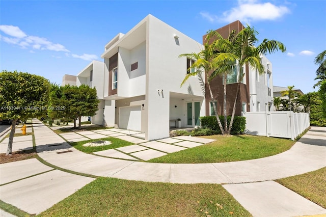 10431 NW 68th Ter, Doral, FL 33178 - view of front of house with stucco siding, concrete driveway, and an attached garage