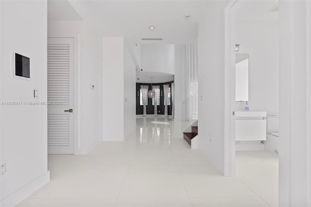10431 NW 68th Ter, Doral, FL 33178 - corridor with tile patterned floors and baseboards