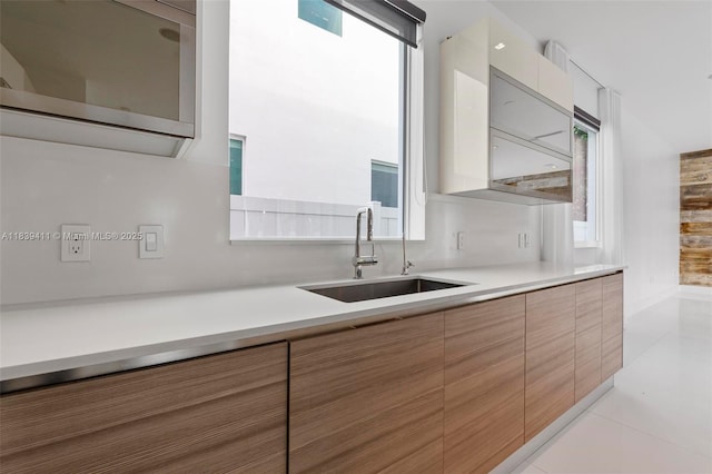 10431 NW 68th Ter, Doral, FL 33178 - kitchen featuring modern cabinets, light countertops, and light tile patterned flooring