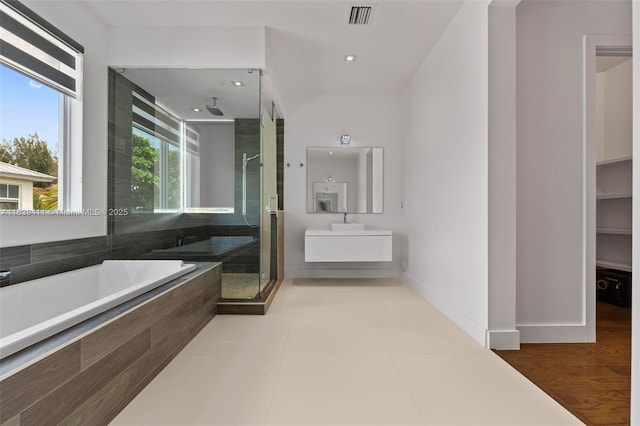 10431 NW 68th Ter, Doral, FL 33178 - bathroom with a shower stall, a bath, and vanity