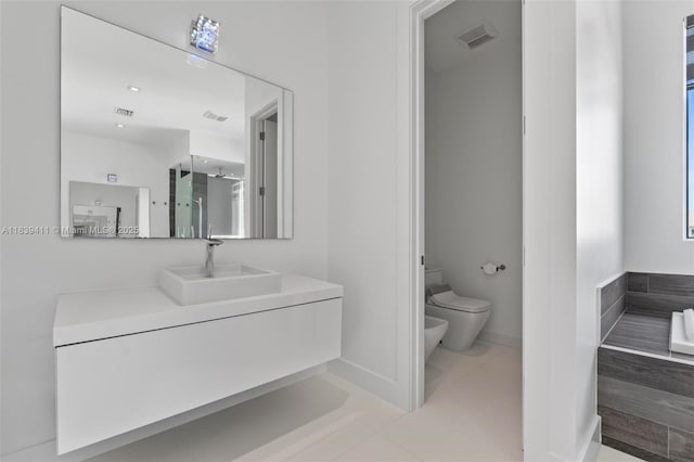 10431 NW 68th Ter, Doral, FL 33178 - full bathroom featuring a bidet, vanity, and tile patterned flooring