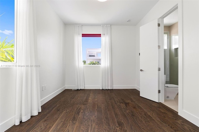 10431 NW 68th Ter, Doral, FL 33178 - empty room with dark wood-style flooring and baseboards