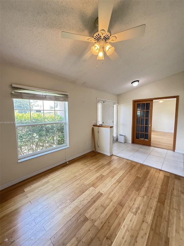 5338 NW S Crisona Cir, Port St Lucie, FL 34986 - spare room featuring a textured ceiling, light wood finished floors, and ceiling fan