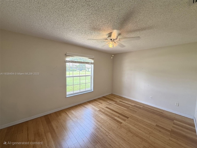 5338 NW S Crisona Cir, Port St Lucie, FL 34986 - unfurnished room featuring ceiling fan, wood finished floors, and a textured ceiling