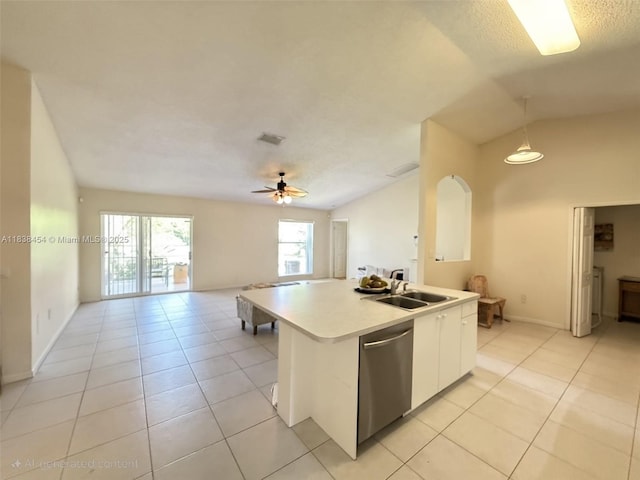 5338 NW S Crisona Cir, Port St Lucie, FL 34986 - kitchen with stainless steel dishwasher, open floor plan, light countertops, light tile patterned floors, and vaulted ceiling