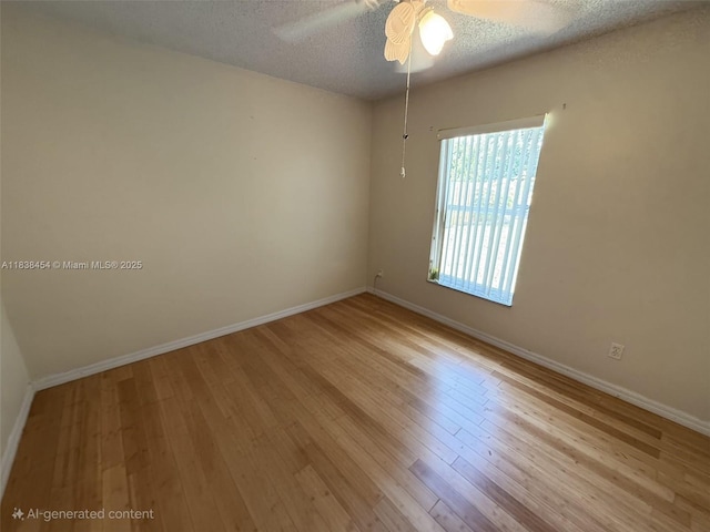 5338 NW S Crisona Cir, Port St Lucie, FL 34986 - empty room featuring a textured ceiling, wood finished floors, and ceiling fan