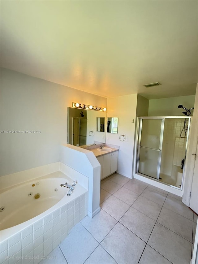 5338 NW S Crisona Cir, Port St Lucie, FL 34986 - full bathroom with a stall shower, a tub with jets, tile patterned floors, and vanity