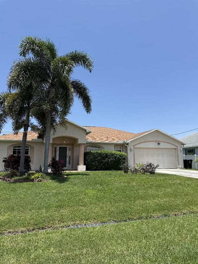5338 NW S Crisona Cir, Port St Lucie, FL 34986 - ranch-style house with stucco siding, a garage, driveway, and a front lawn