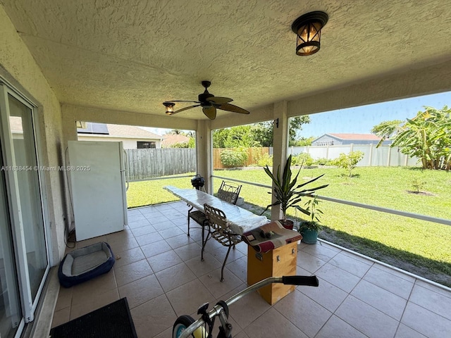 5338 NW S Crisona Cir, Port St Lucie, FL 34986 - fenced backyard with ceiling fan and a patio area
