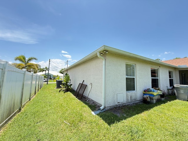 5338 NW S Crisona Cir, Port St Lucie, FL 34986 - view of home's exterior with stucco siding and a central air condition unit