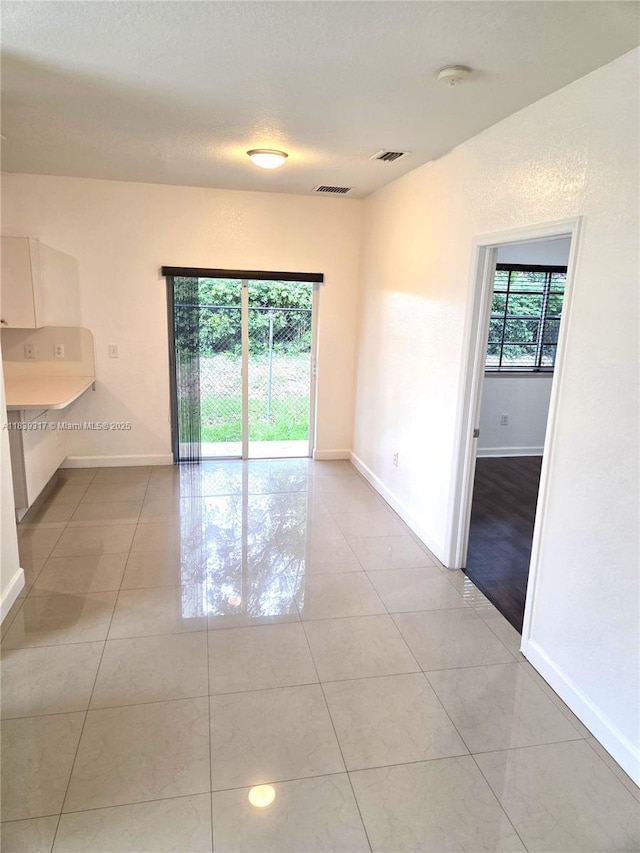2630 NE 3rd Dr Unit 101, Homestead, FL 33033 - spare room with light tile patterned flooring and a smoke detector