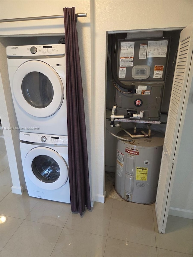 2630 NE 3rd Dr Unit 101, Homestead, FL 33033 - laundry area featuring stacked washer / drying machine, water heater, and tile patterned floors