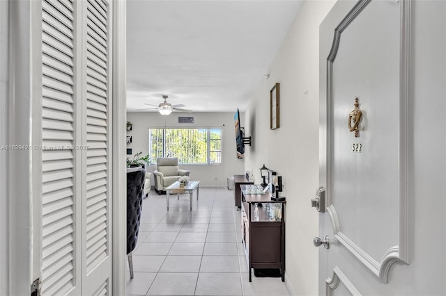 5800 NE 22nd Way Unit 523, Fort Lauderdale, FL 33308 - hallway featuring light tile patterned floors and baseboards
