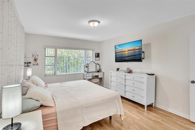 5800 NE 22nd Way Unit 523, Fort Lauderdale, FL 33308 - bedroom with light wood-type flooring and baseboards