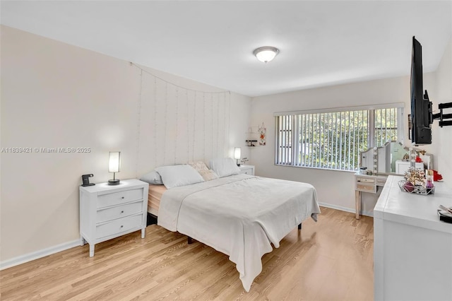 5800 NE 22nd Way Unit 523, Fort Lauderdale, FL 33308 - bedroom with light wood finished floors and baseboards