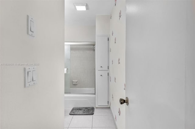 5800 NE 22nd Way Unit 523, Fort Lauderdale, FL 33308 - full bath featuring tile patterned flooring and bath / shower combo with glass door