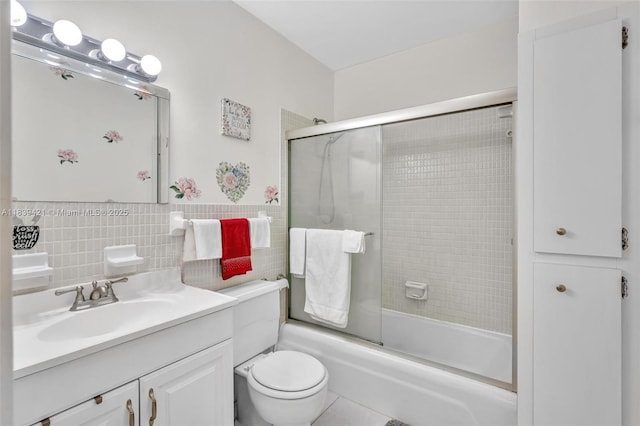 5800 NE 22nd Way Unit 523, Fort Lauderdale, FL 33308 - full bath featuring vanity, shower / bath combination with glass door, and tile walls