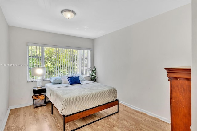 5800 NE 22nd Way Unit 523, Fort Lauderdale, FL 33308 - bedroom with light wood-style floors and baseboards