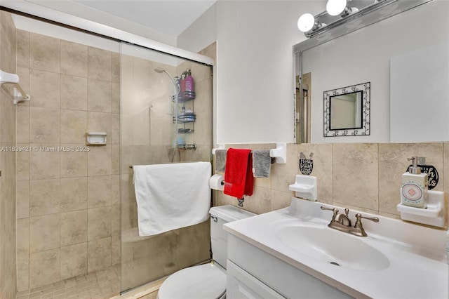 5800 NE 22nd Way Unit 523, Fort Lauderdale, FL 33308 - full bath featuring a shower stall, vanity, tile walls, and tasteful backsplash