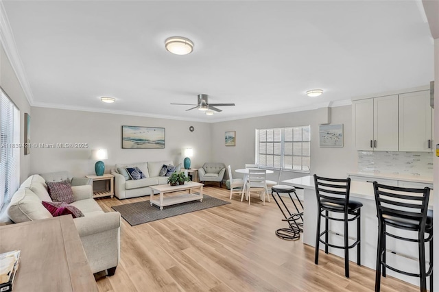 5800 NE 22nd Way Unit 523, Fort Lauderdale, FL 33308 - living area featuring crown molding, a ceiling fan, and light wood-type flooring
