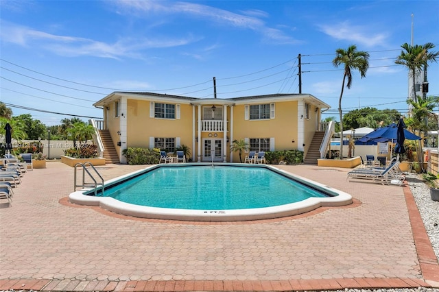 5800 NE 22nd Way Unit 523, Fort Lauderdale, FL 33308 - community pool with stairs, french doors, and a patio